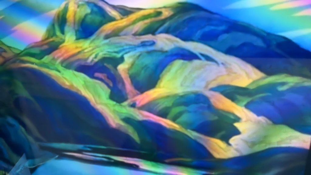 Camera frame of a landscape painting on a screen